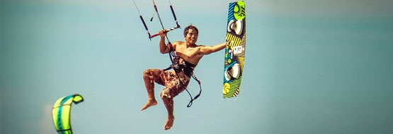 kiteboard instructor doing a trick in the air